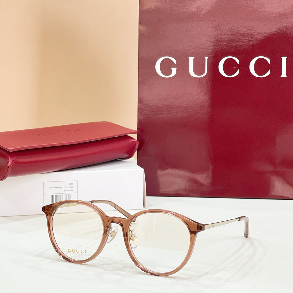 Gucci eyeglasses with round brown tortoiseshell frames and clear lenses