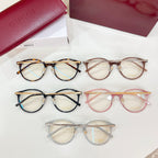 Assorted Gucci eyeglasses with round frames in black, tortoise, pink, and clear
