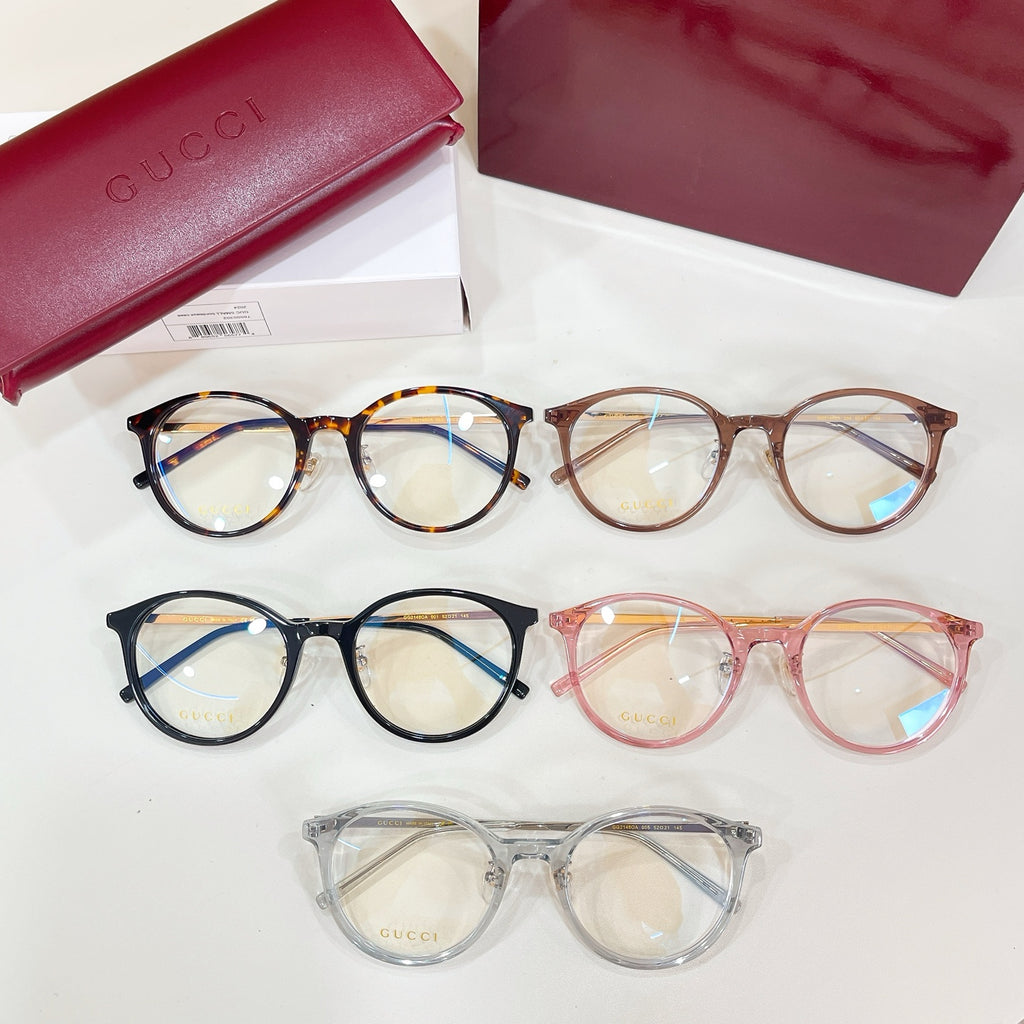 Assorted Gucci eyeglasses with round frames in black, tortoise, pink, and clear