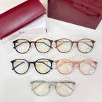Assorted Gucci eyeglasses with round frames in black, tortoise, pink, and clear