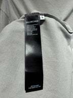 Light gray T-shirt with black size and care tag under the collar seam