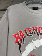 Light gray T-shirt with red and white graphic lettering across the chest
