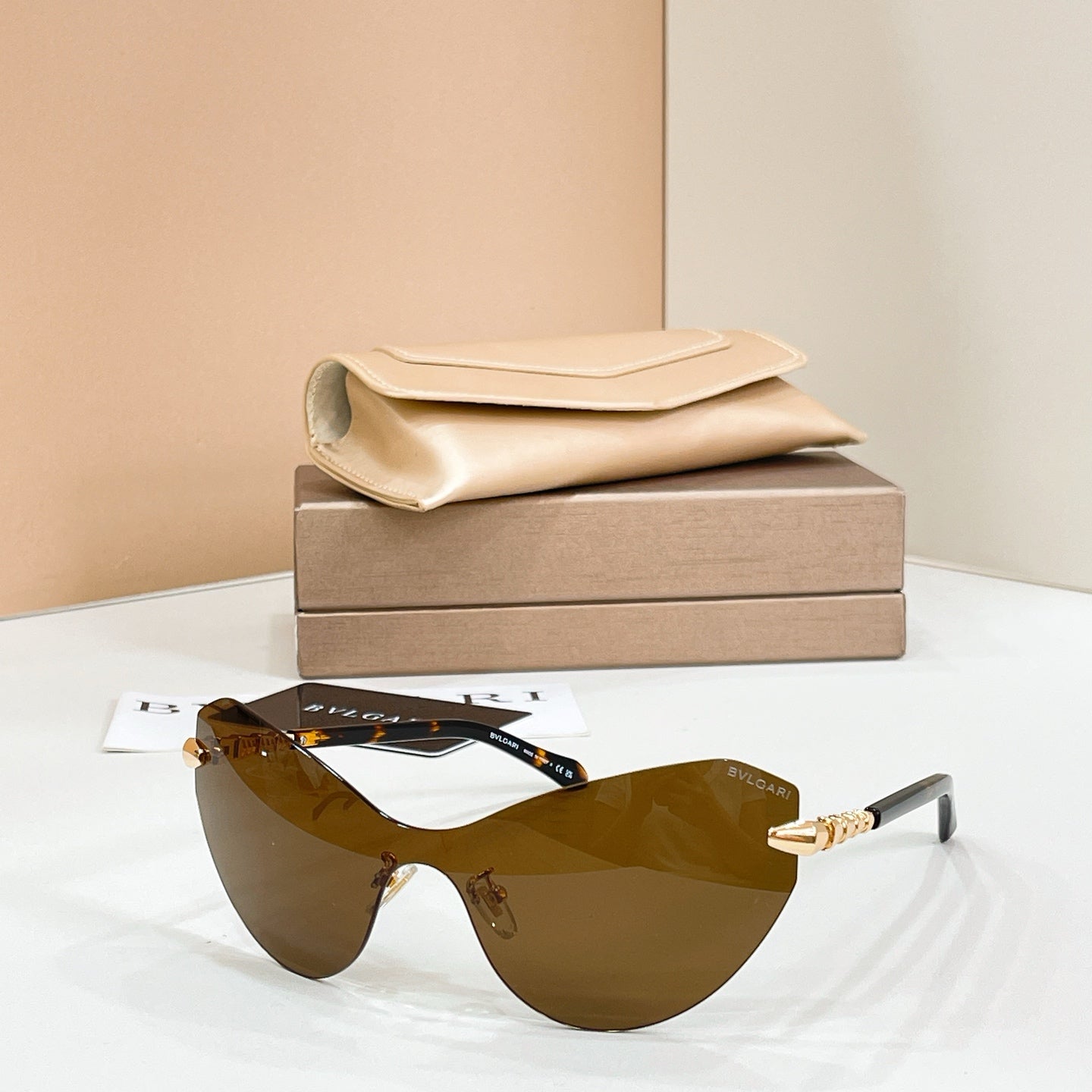 Brown gradient sunglasses with black frame and gold-tone temple accents