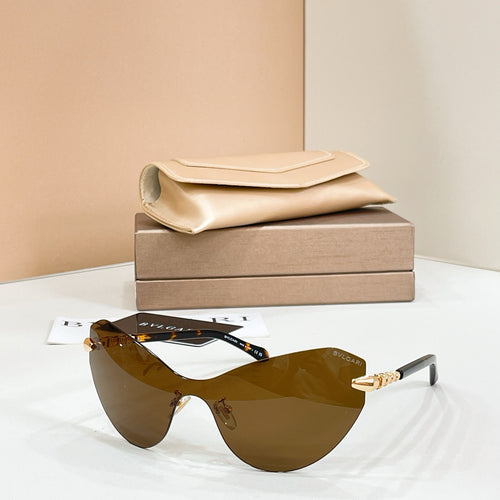 Brown gradient sunglasses with black frame and gold-tone temple accents
