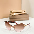 Rose-tinted gradient sunglasses with red frame and gold-tone temple accents