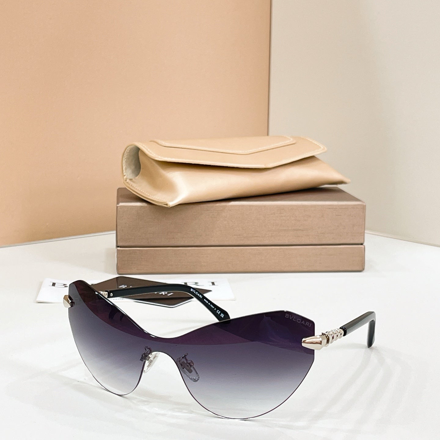 Dark purple gradient sunglasses with black frame and gold-tone temple tips