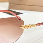 BVLGARI red sunglasses temple close-up with gold-tone hinge