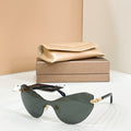 Dark green gradient sunglasses with black frame and gold-tone temple tips