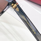 Gucci sunglasses temple detail with gold clasp and lettering