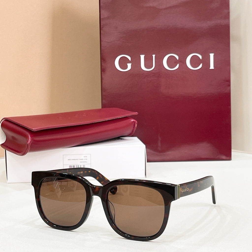 Gucci square sunglasses with black frames and brown-tinted lenses