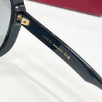 Black sunglasses temple with GUCCI and MADE IN ITALY lettering