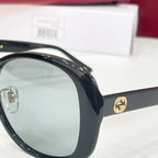 Black sunglasses close-up with tinted lens and glossy frame edge