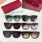 Set of Gucci eyeglasses with green, black, purple, and tortoiseshell frames.