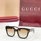 Tortoiseshell square eyeglass frames with clear lenses and Gucci logo temples.