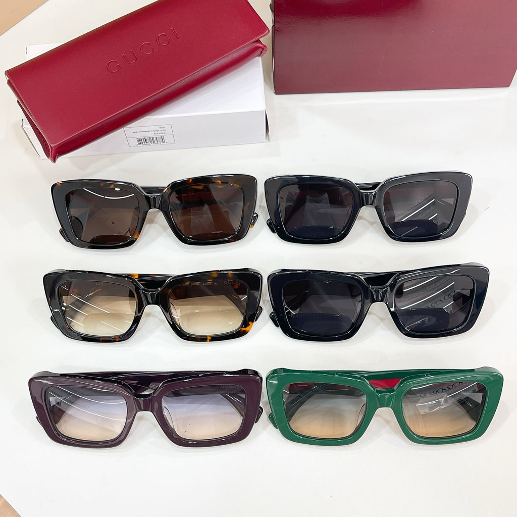 Assorted sunglasses set with black, tortoiseshell, green, and purple frames