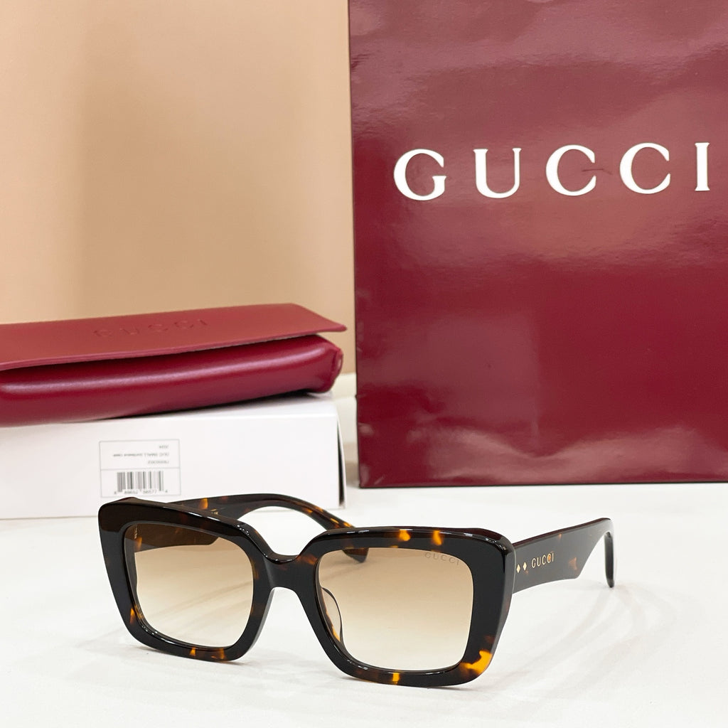 Square tortoiseshell sunglasses with warm amber-tinted lenses
