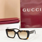 Square tortoiseshell sunglasses with warm amber-tinted lenses