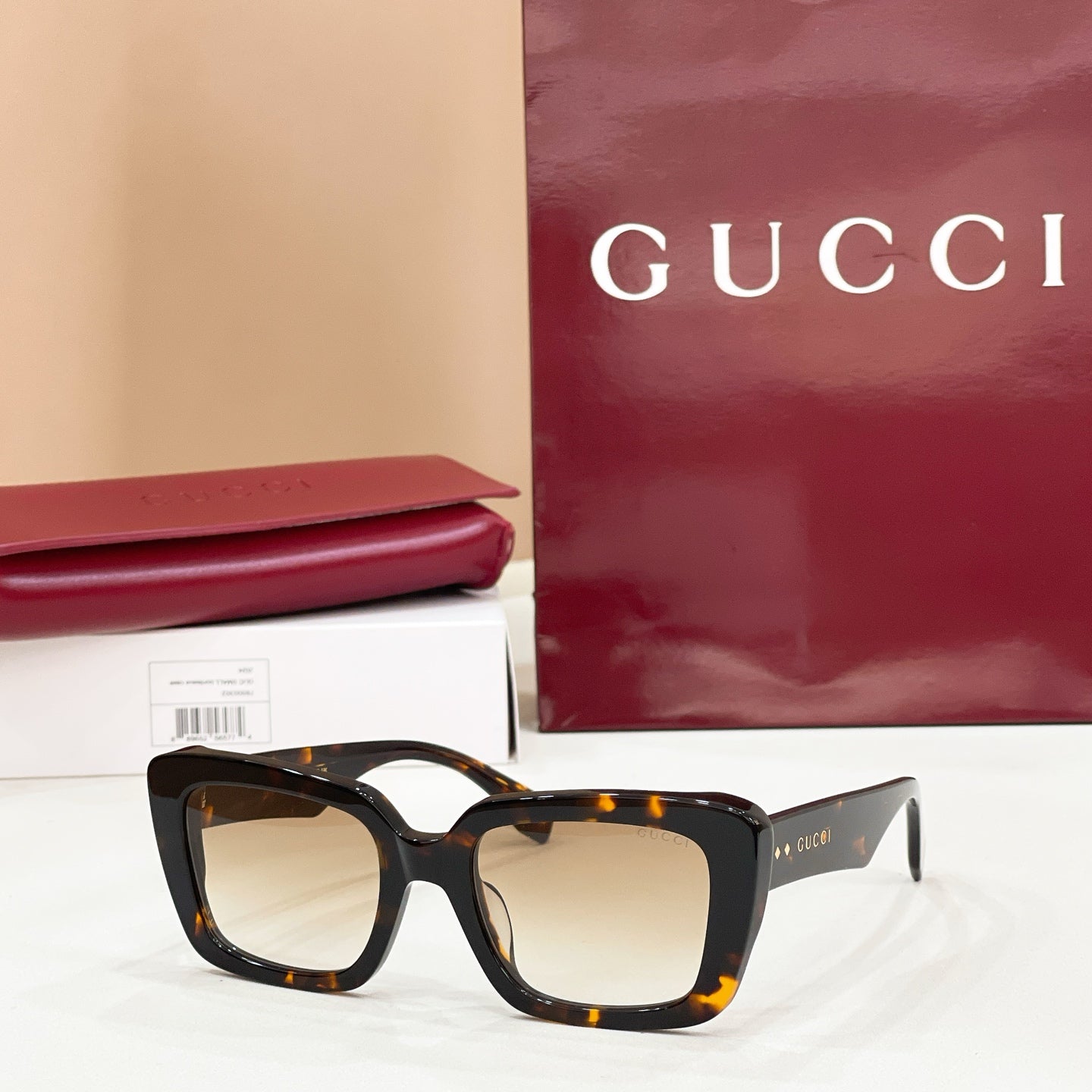 Square tortoiseshell sunglasses with warm amber-tinted lenses