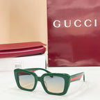 Square green sunglasses with light-tinted lenses and thick frames