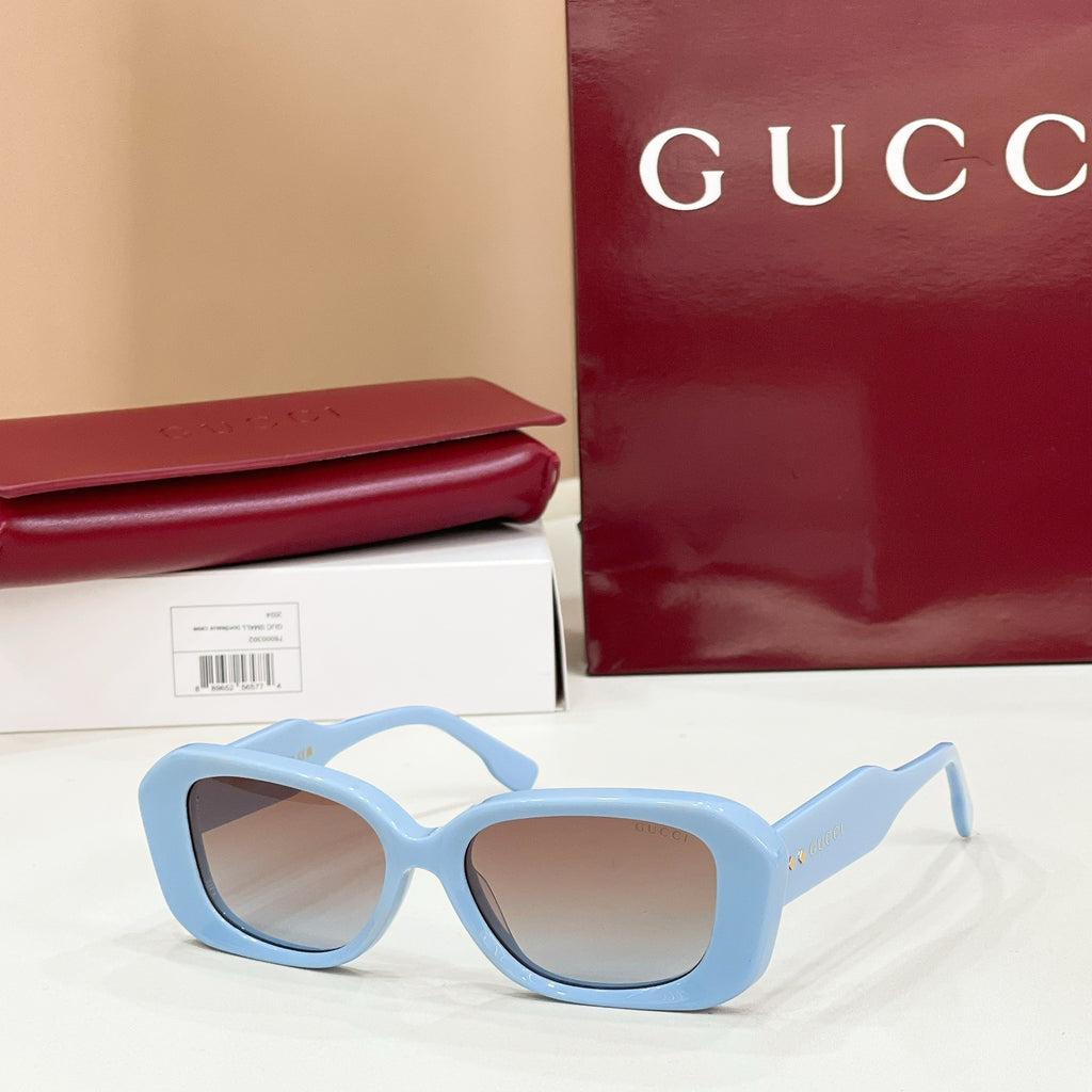 Gucci sunglasses, light blue cat-eye frames with light-tinted lenses