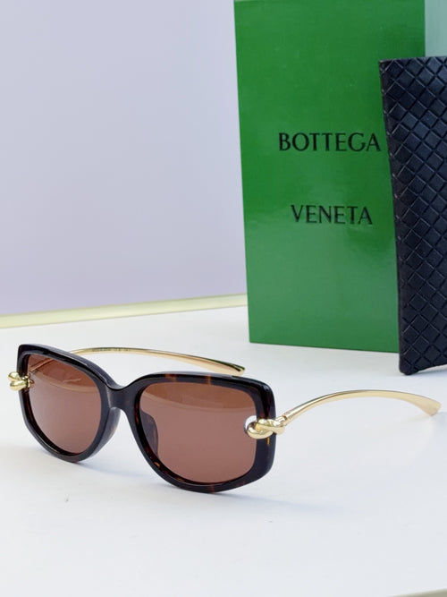 Dark tortoise eyeglasses with brown-tinted lenses and gold-tone temples