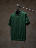 Green Dior crewneck short-sleeve knit top on hanger