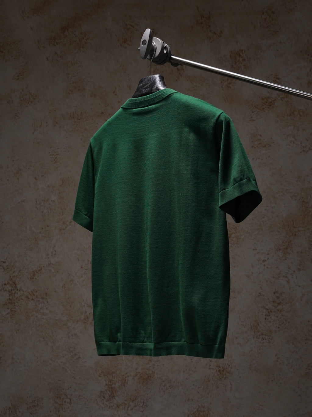 Green Dior crewneck short-sleeve knit top, back view on hanger