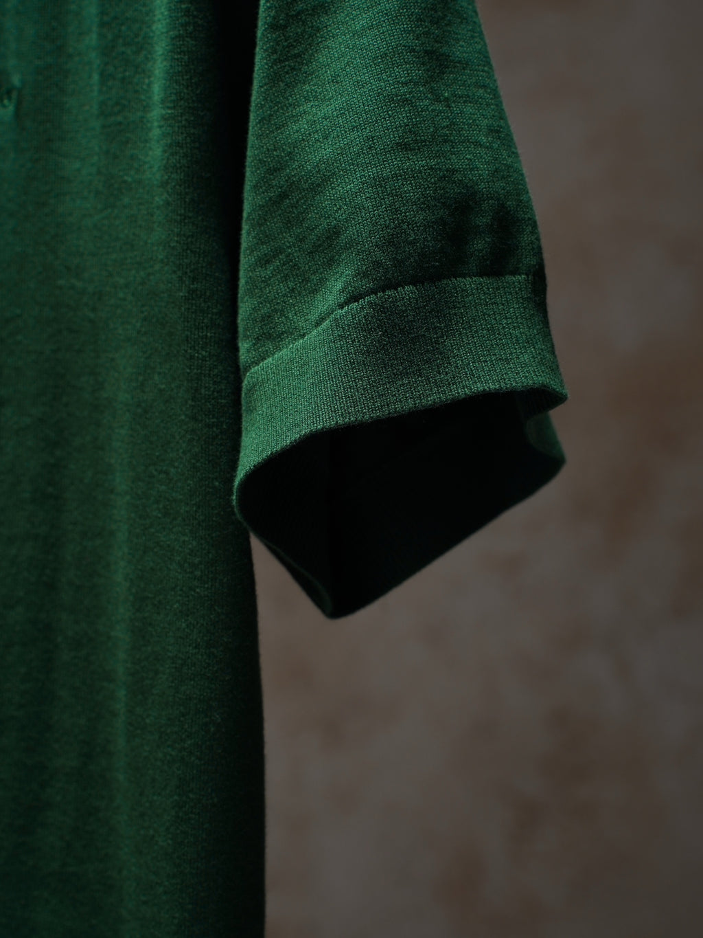 Dior green knit top sleeve and hem detail