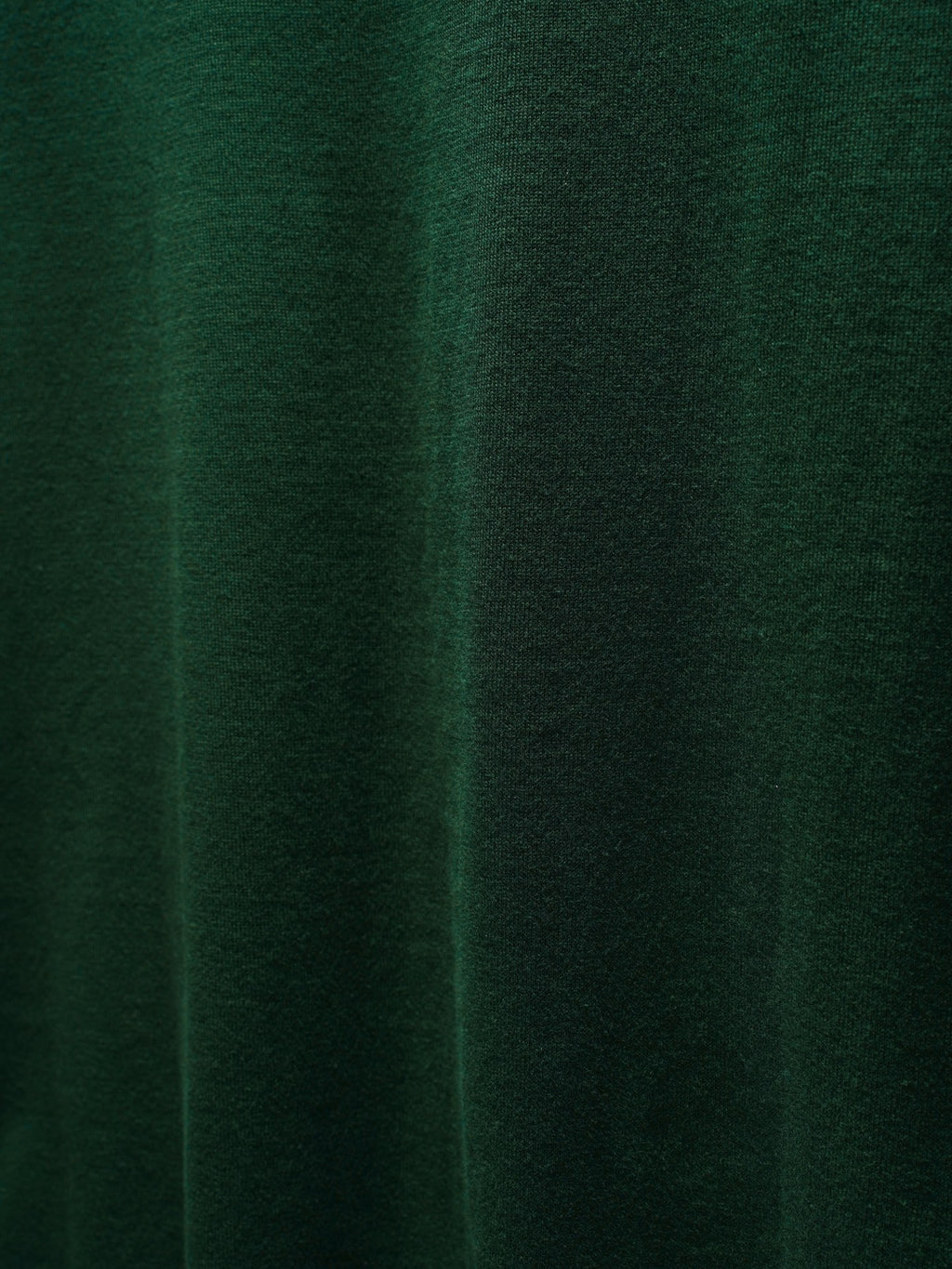 Green Dior knit fabric close-up with subtle texture