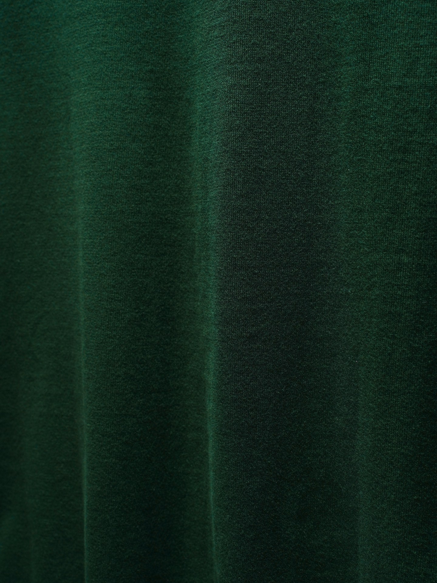 Green Dior knit fabric close-up with subtle texture