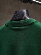 Green Dior crewneck knit top, back collar close-up