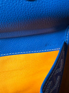 Blue bag exterior with yellow-orange lining edge and contrast stitching
