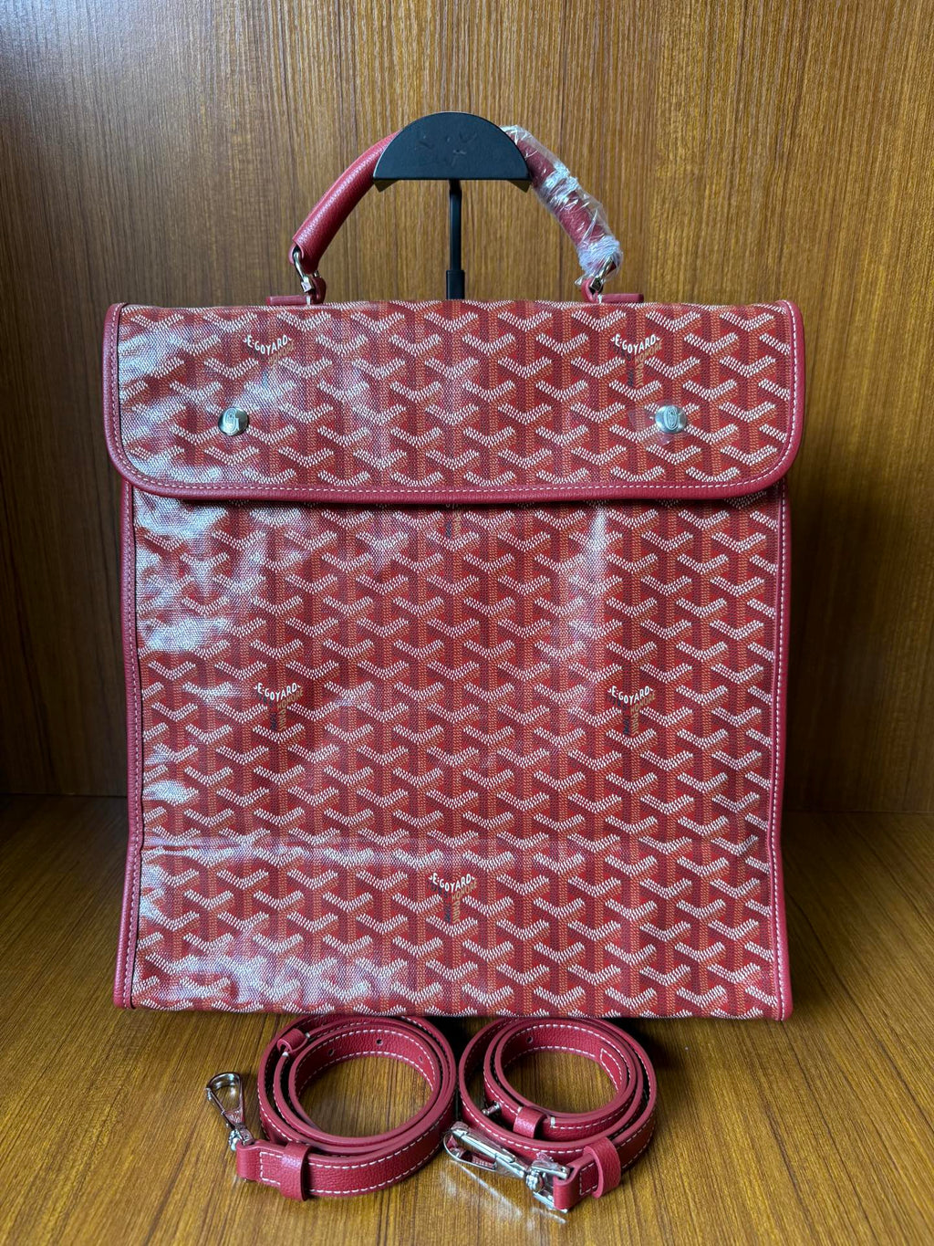 Red Goyard patterned handbag with flap and matching strap set, front view