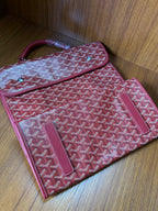 Red Goyard patterned handbag with exterior pocket and slim strap loop