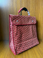 Red Goyard patterned handbag with side flap, top handle, structured shape