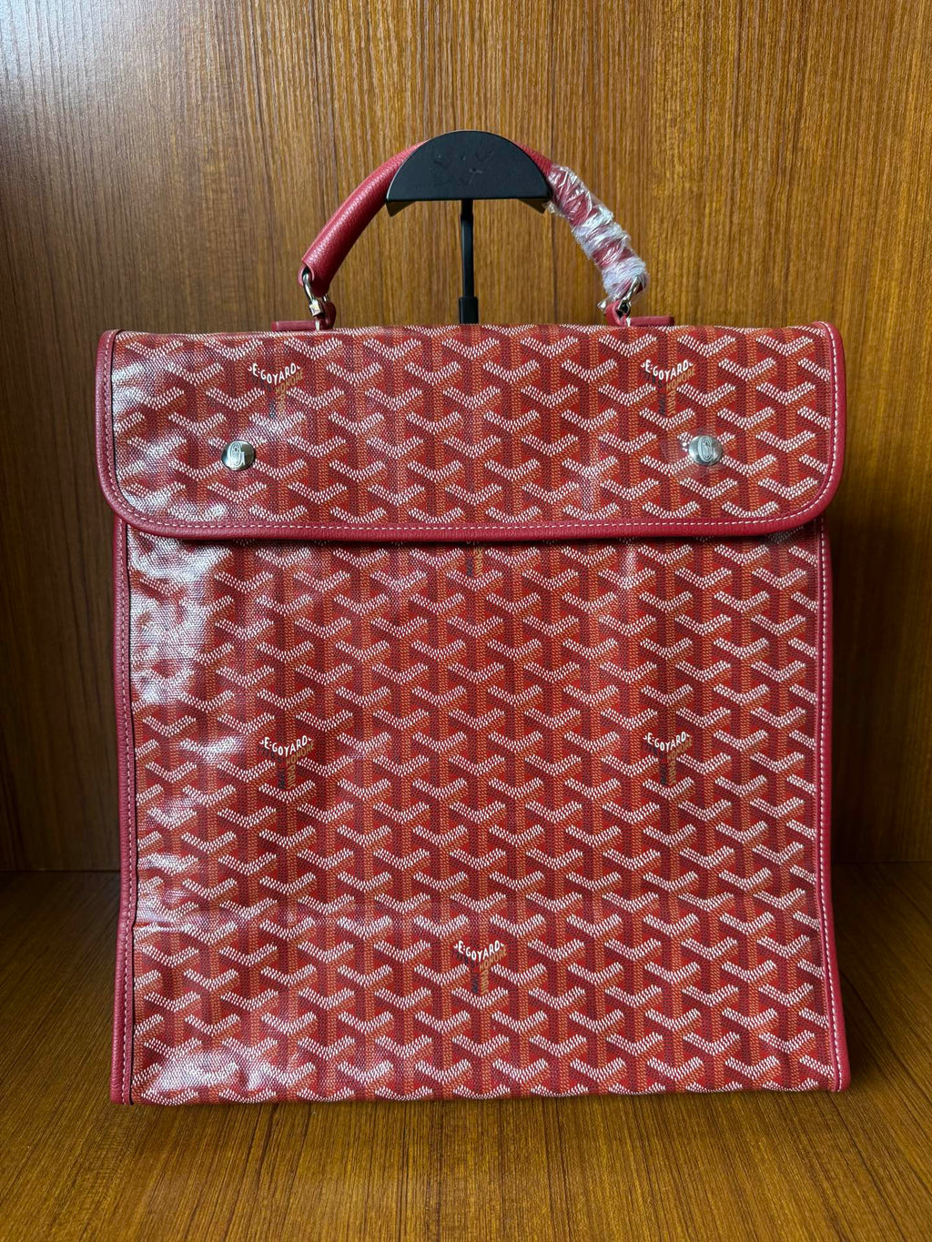 Red Goyard patterned handbag with top handle and flap, front view