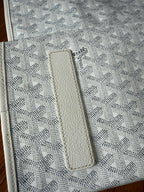 Designer monogram tote bag in light gray with stitched leather tab patch