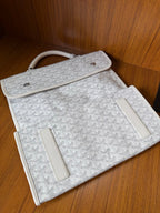 Designer monogram tote bag in light gray with front strap and hardware details