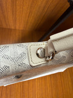Designer monogram tote bag in light gray with metal clasp and leather detail