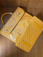 Yellow patterned tote bag with flap and side pouch detail