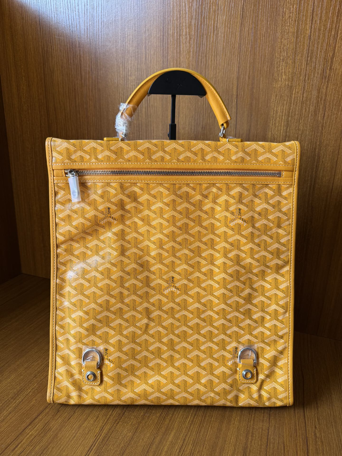 Yellow patterned tote bag with front zip pocket and hanging strap hardware