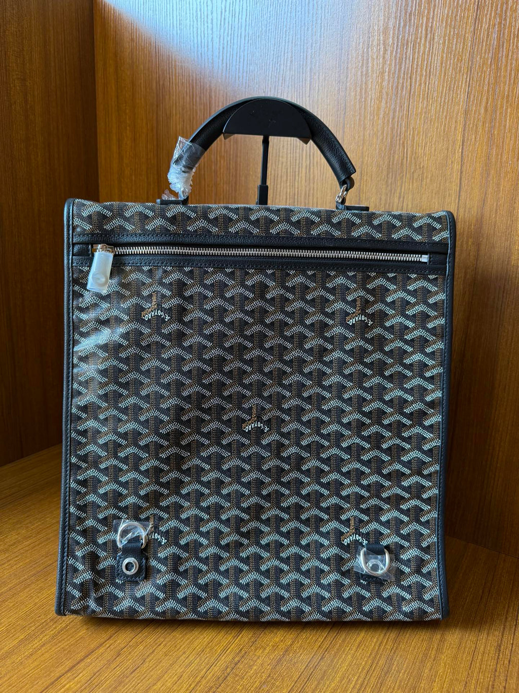 Goyardine patterned bag with top handle, rear view and snap details, dark blue-gray.