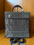 Goyardine patterned bag with top handle and matching strap, dark blue-gray.