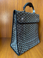 Goyardine patterned tote bag, side view, fold-over flap, dark blue-gray.