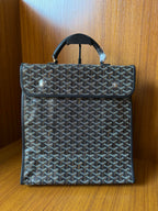 Goyardine patterned bag with fold-over flap and top handles, dark blue-gray.