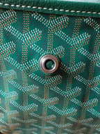 Teal patterned bag side with round eyelet for strap attachment