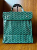 Teal patterned tote bag with flap, top handle, and silver-tone hardware