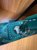 Teal leather handle with silver-tone hardware and snap button detail