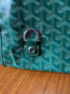 Teal patterned bag lock with silver-tone clasp and circular keeper