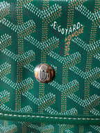Goyard logo on teal patterned flap with silver-tone snap button